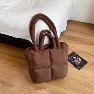 Quilted oversized shoulder bag in dark coffee brown with padded puffy nylon texture