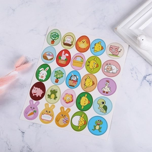 Close-up of Happy Easter stickers featuring colorful cartoon rabbits and eggs on marble