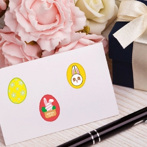 Easter decorative stickers featuring cute bunnies and eggs on white card with floral background