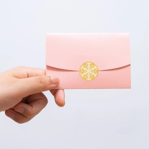 Pink pearlescent mini envelope with a gold snowflake seal sticker for gift cards