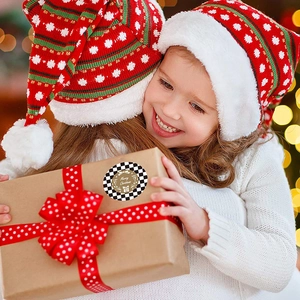 Merry Christmas gift stickers with black and white plaid border on kraft paper box
