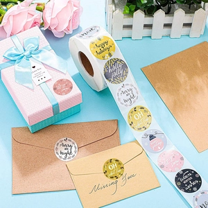 Christmas gift stickers roll with Happy Holidays designs for gift wrapping and envelopes