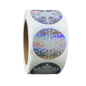 Roll of iridescent laser snowflake stickers with white Merry Christmas design on white base