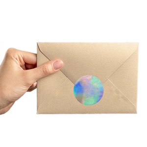Holographic round silver heart stickers on kraft envelope for sealing and decoration