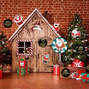 Black and gold Merry Christmas gift labels featuring Santa Claus masks and festive motifs