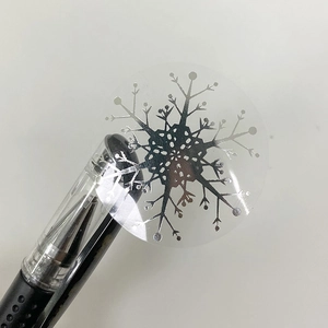 Transparent round Christmas sticker with silver snowflake pattern for gift packaging