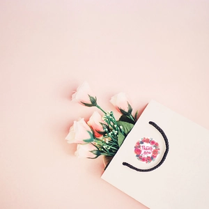 Floral Thank You stickers with pink roses on white paper gift bags for gift decoration