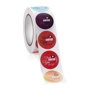 Macro view of colorful Coffee Thank You stickers roll for bakery packaging and seals