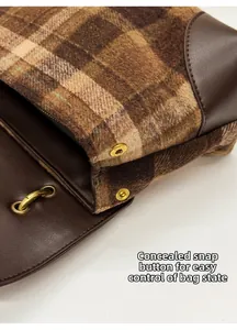 Detail view of tweed texture and hidden snap button for adjustable capacity