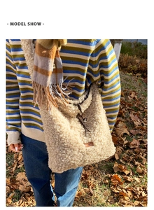 Furry cream-white lamb wool tote bag worn by a model in an outdoor autumn setting