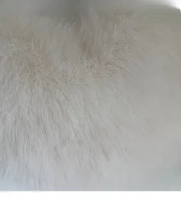 Detailed macro shot of high-quality fluffy faux fur fabric on this plush shoulder bag