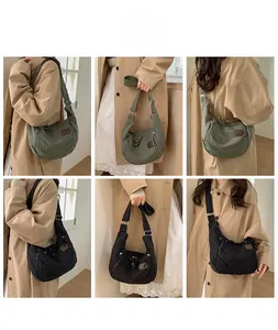 Detail showing military green and black nylon dumpling bags with multiple functional pockets