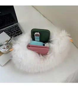 Detail of the white fluffy plush bag showing large internal capacity for essentials