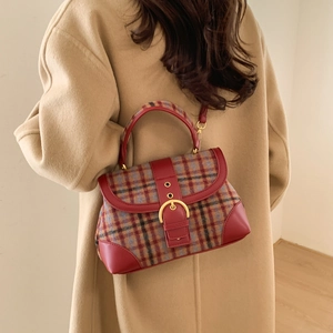 British style plaid handbag with red leather trim shown styled on a beige cashmere coat