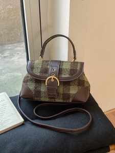 Vintage green plaid wool handbag with dark brown leather trim and golden metal buckle