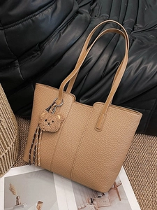 Classic khaki faux leather tote bag with pebble texture and cute bear charm for daily use