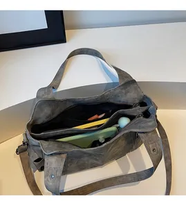 Interior view showing spacious compartments of the vintage matte leather tote bag