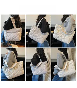 Multiple views of a large quilted puffer tote bag featuring wave stitching and side pocket