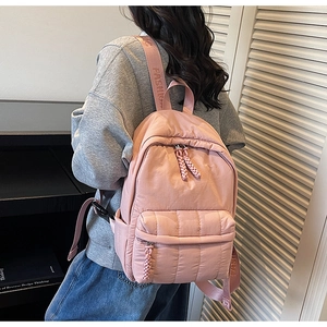 Pink quilted backpack detail with FASHION strap and drawstring zipper for school
