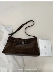 Detailed view of deep brown vintage leather tote with iPad for size reference