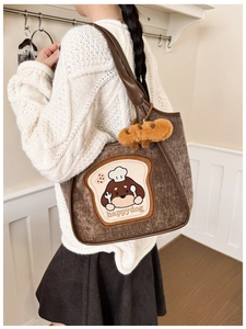 Brown corduroy tote bag with cute puppy embroidery and plush bread keychain detail