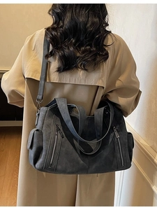 Large dark grey soft leather tote bag with double zippers for women shown on model