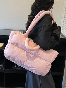 Stylish light pink puffer tote bag with quilted design for women commuting and daily use