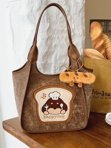 Brown corduroy tote bag with cute dog embroidery and plush bread keychain accessory