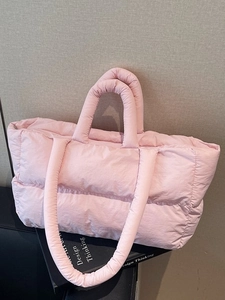 Pink quilted down tote bag with dual straps and soft nylon puffer texture for women