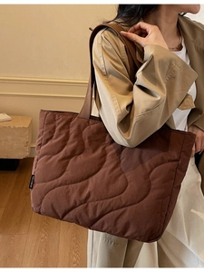 Brown large capacity quilted tote bag with wave stitching and soft texture for winter