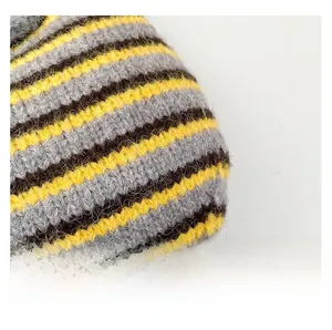Macro shot of French woven bucket bag featuring thick knit texture in yellow and grey