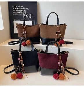 Detailed comparison of vintage suede bucket bags in four colors with beaded tassel charms