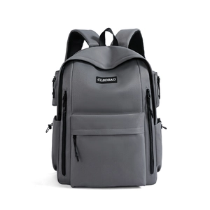 Front detail of dark grey textured fabric backpack featuring CLBDBAG woven label