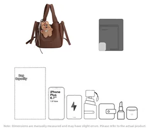 Detail view of large capacity dark brown bucket bag showing daily essentials storage