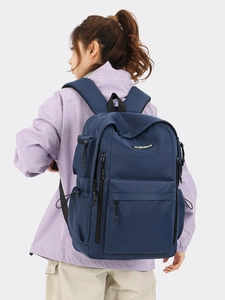 Large dark blue commuting travel backpack with durable nylon and padded shoulder straps