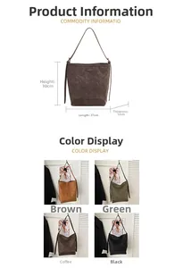 Detail view of large bucket bag with vintage matte texture and small metal logo plate