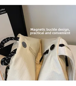 Detail of off-white checkered canvas backpack with magnetic closure and inner zip pocket