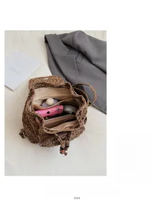 Top view of leopard print backpack interior showing large capacity with phone and wallet