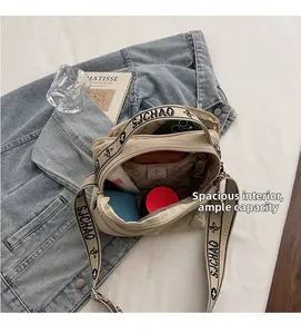 Spacious interior of the beige canvas tote bag with functional pockets and large capacity