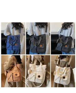 Multi-pocket canvas tote bags in six colors shown in a lifestyle model grid