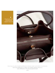Internal view of the leather bucket bag showing dual compartments and zipper pocket