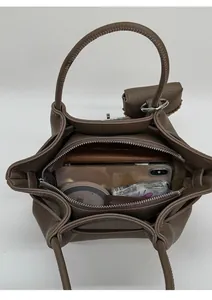 Top view of brown lychee grain handbag showing spacious interior for daily essentials