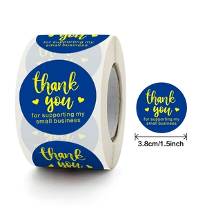 Pink and gold foil Thank You stickers on a roll for small business packaging