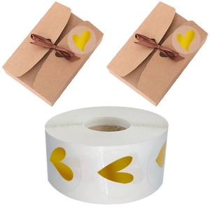 Roll of gold foil heart seal stickers on clear film for envelopes and gift wrapping