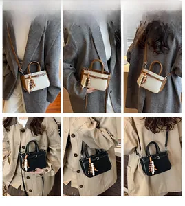 Grid view of a mini faux leather crossbody bag with stylish beaded charms and long strap