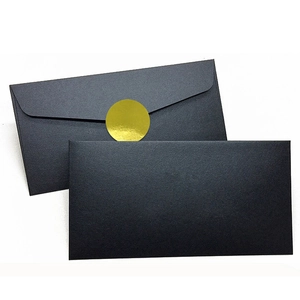 Minimalist matte black envelope set with elegant gold round seal stickers for weddings