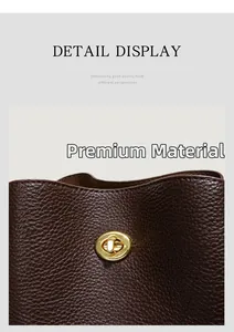 Detail view of lychee pattern leather bucket bag with premium gold rotating metal twist lock