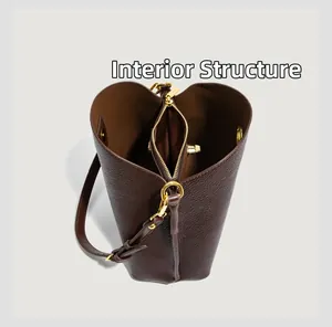 Detailed interior of the brown lychee leather bucket bag with three-compartment structure