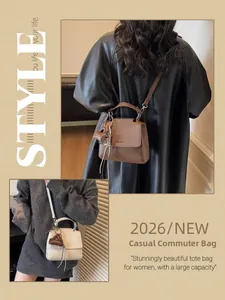 Litchi pattern leather bag with tassel detail and round handle for office and daily style
