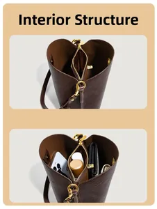 Detail view showing internal compartments and leather texture of the brown bucket bag